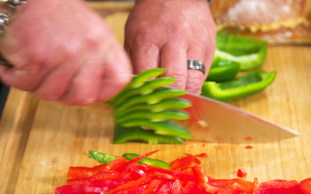 Guy Knuckle Sandwich Chef knife cutting peppers